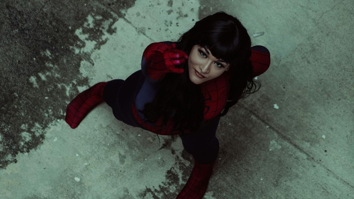 woman in superhero costume looking up